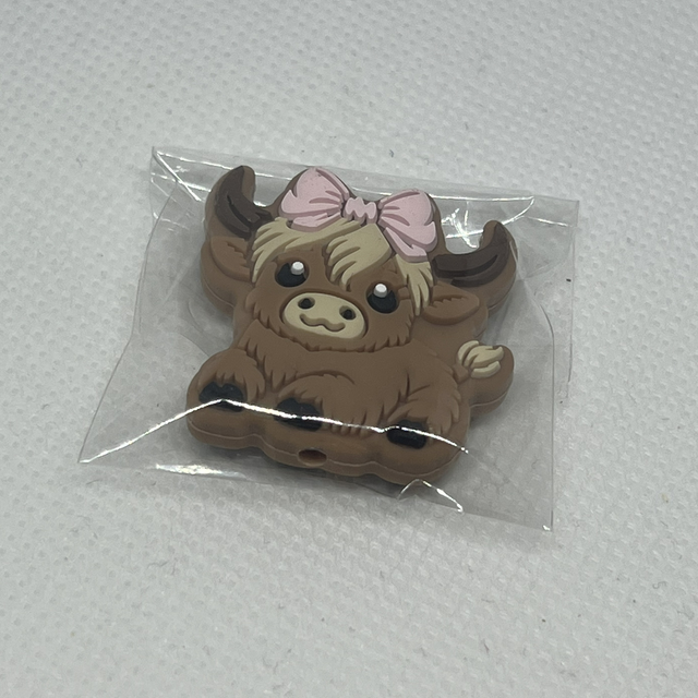 Ku med rosa sløyfe Maskestopper