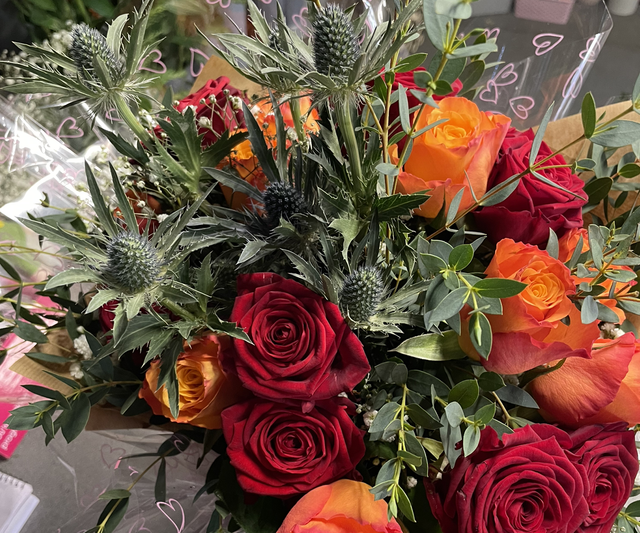 Red and orange rose aqua pack fresh flower bouquet 