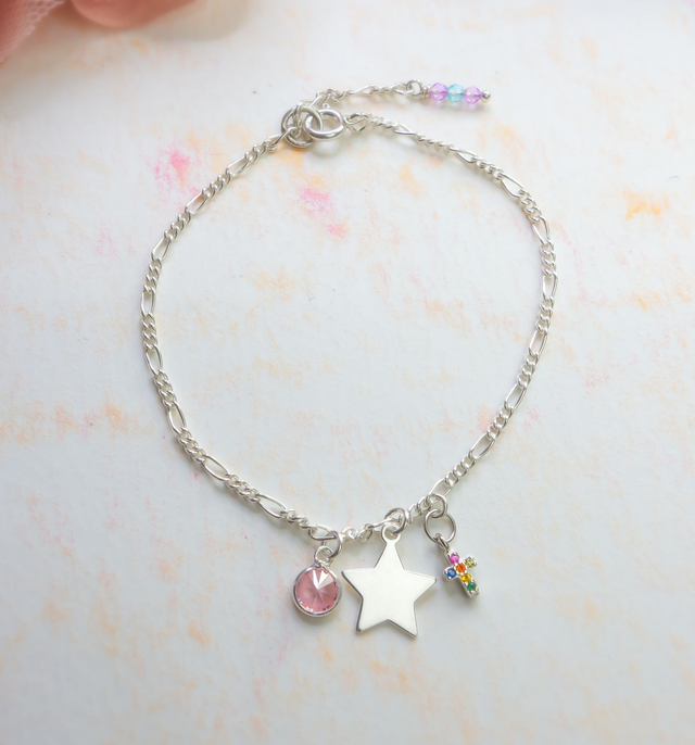 Pulsera de plata 925 en cadenas y con abalorios de estrella, cruz con circonitas de colores y una circonita rosa