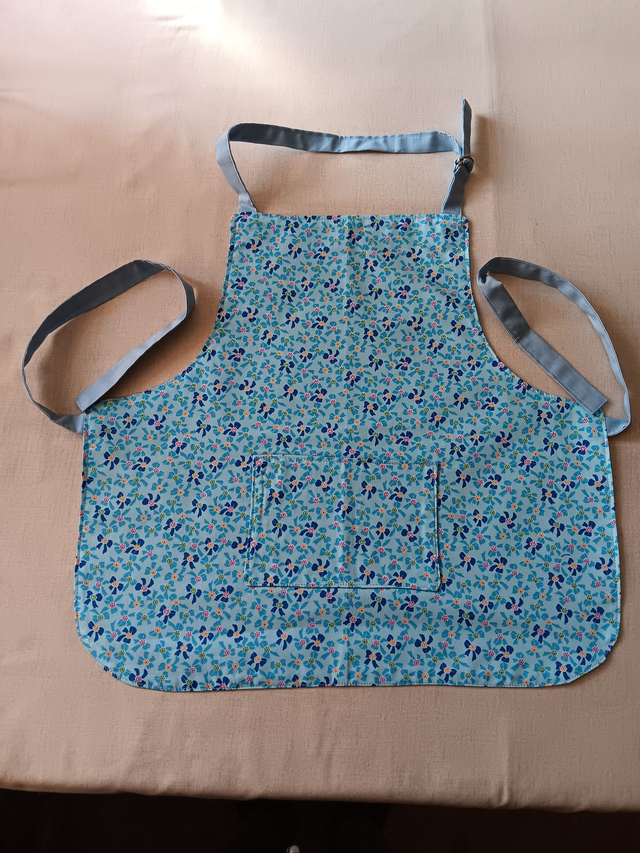 Childs Kitchen/Play Apron  Blue Bows Cotton Fabric with Front pocket and pale blue lining, waist ties and adjustable neck tie