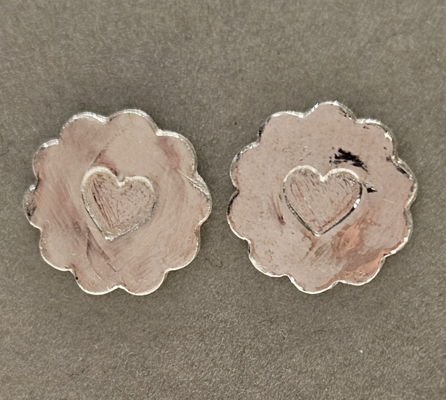 Flower with central heart silver studs