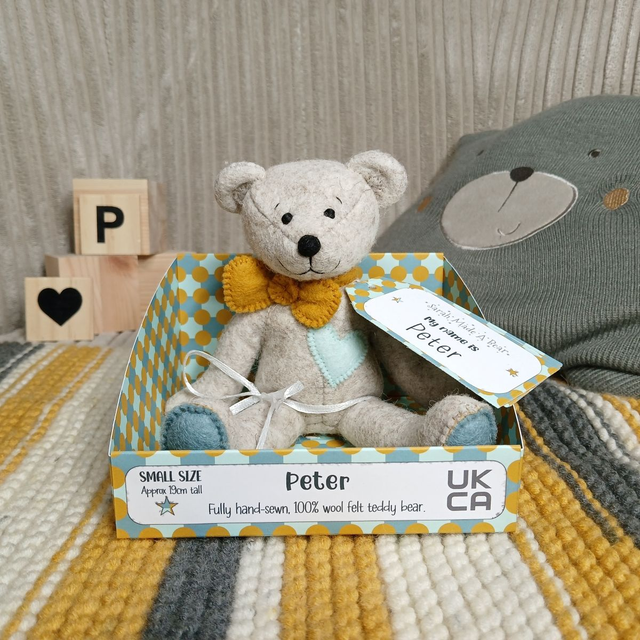 Peter. Small size, handmade teddy bear. UKCA. Tray base packaging. Standard Wool Felt. Beige. Mustard. Dusky blue. Spearmint.