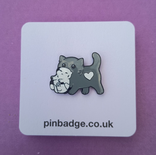  Cat carrying a kitten