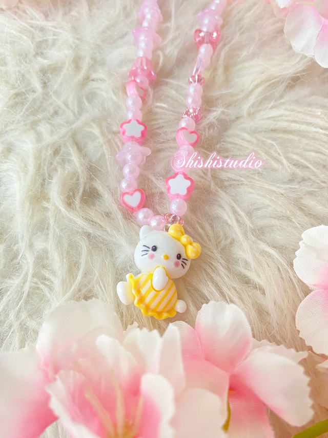 Hello Kitty yellow bracelet phone strap 