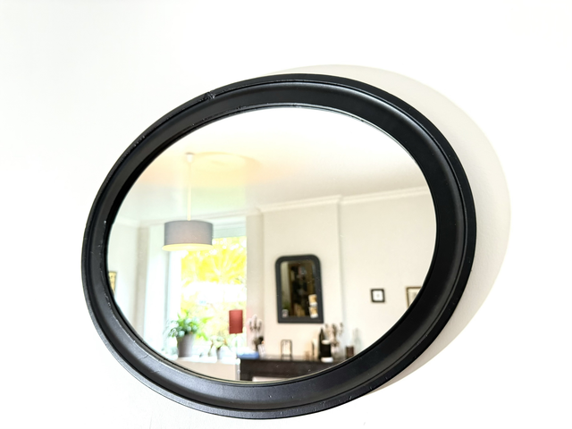 Ancien miroir ovale noir