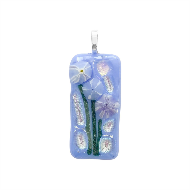 Pendant with pale blue background, green stems, murrine flowers and a touch of sparkling dichroic glass. (Ref P36)