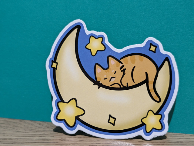 Ginger Cat Sleeping on Crescent Moon