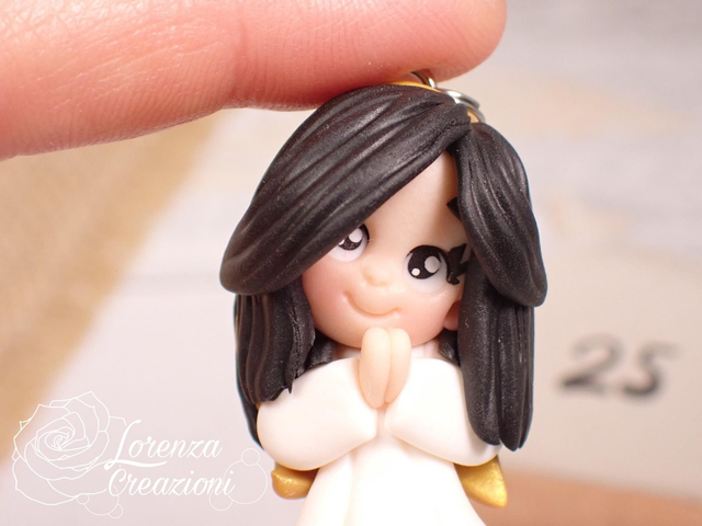 Angioletto custode tascabile n. 25
Portachiavi o charm, artigianale, pezzo unico. Modellato a mano argilla polimerica, made in Italy.
