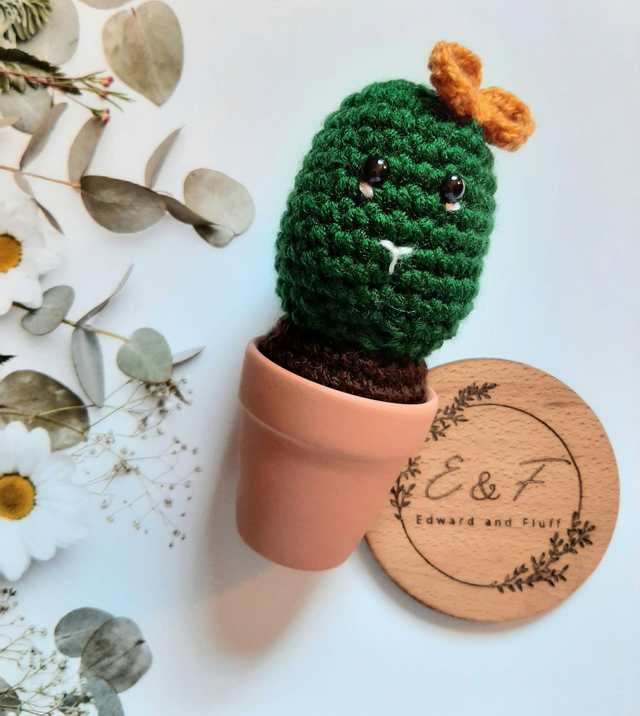 Handmade crochet cactus plant in a terracotta pot