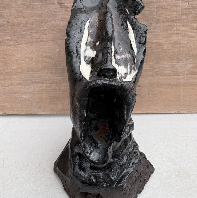 Untitled black and red ceramic figurine