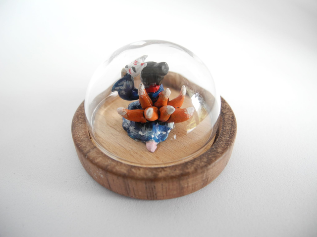 Kitsune disguised as Geisha in a Kimono adorned with waves - miniature pendant for Japan enthusiasts