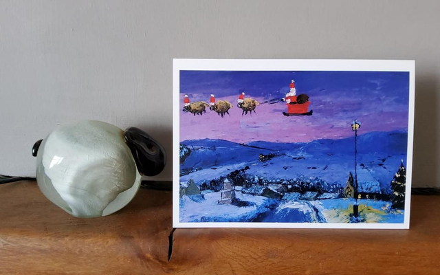 Father Christmas and his flying sheep over Reeth. A6 christmas card. 