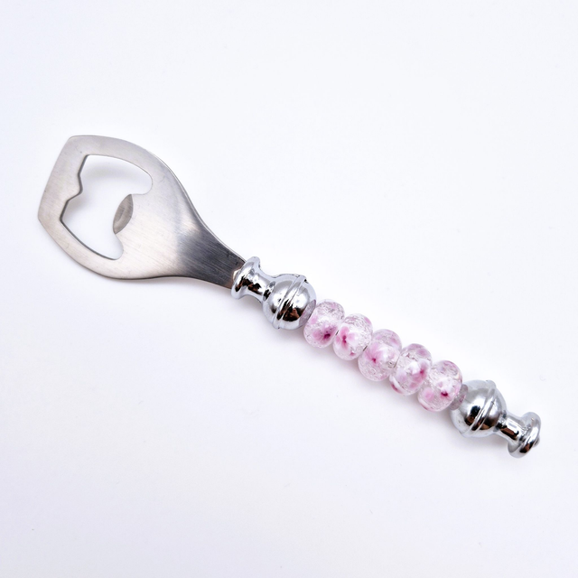 Décapsuleur perles à fleurs roses