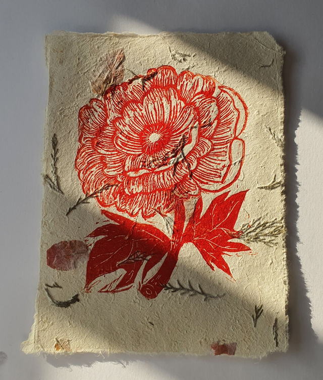 Red poppy linocut on handmade leaf paper