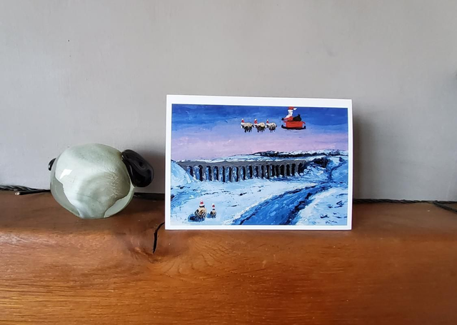 Father Christmas and his flying sheep over Ribblehead Viaduct. A6 christmas card. 