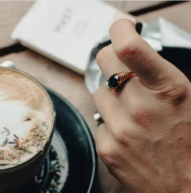 NM gold black gemstone raised half bezel ring
