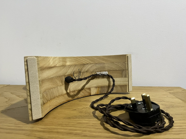 Decorative lamp made of Paulownia wood with a 3D light bulb.