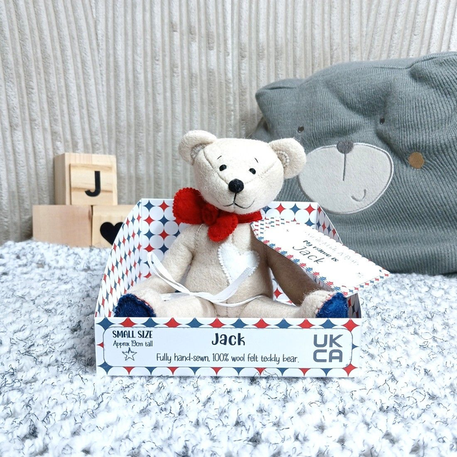 Jack. Small size, handmade teddy bear. UKCA. Tray base packaging. Standard Wool Felt. Beige. Red. White. Navy blue.
