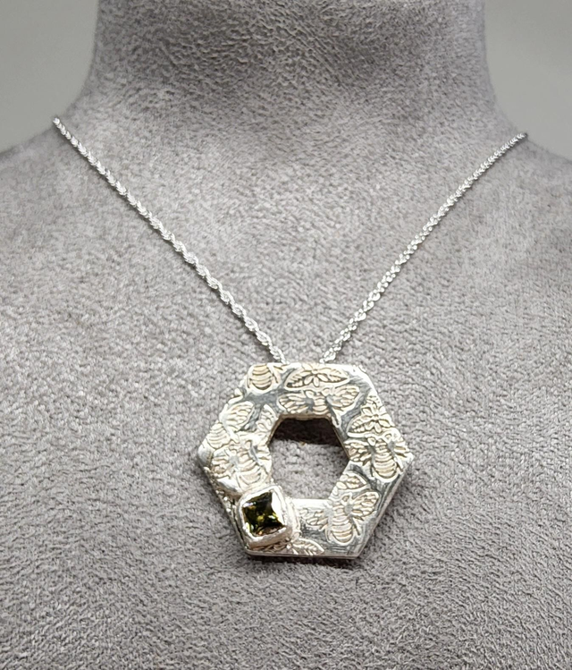 Hexagon bee textured with peridot cubic zirconia pendant on silver necklace