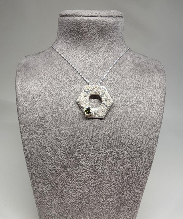 Hexagon bee textured with peridot cubic zirconia pendant on silver necklace