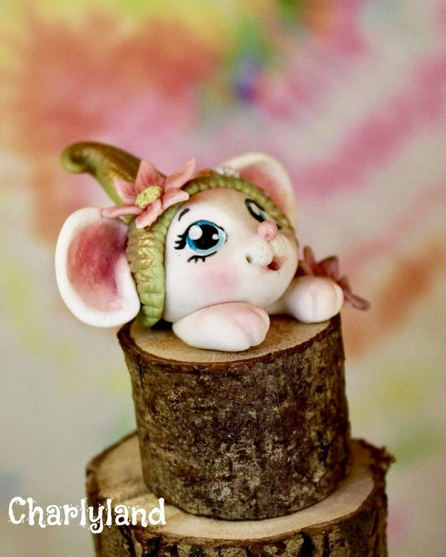 Souris sur socle haut