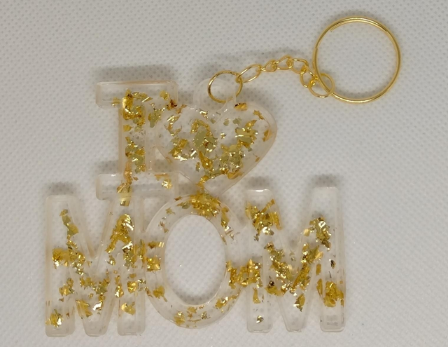 Porte clés avec inclusion de paillettes dorées 