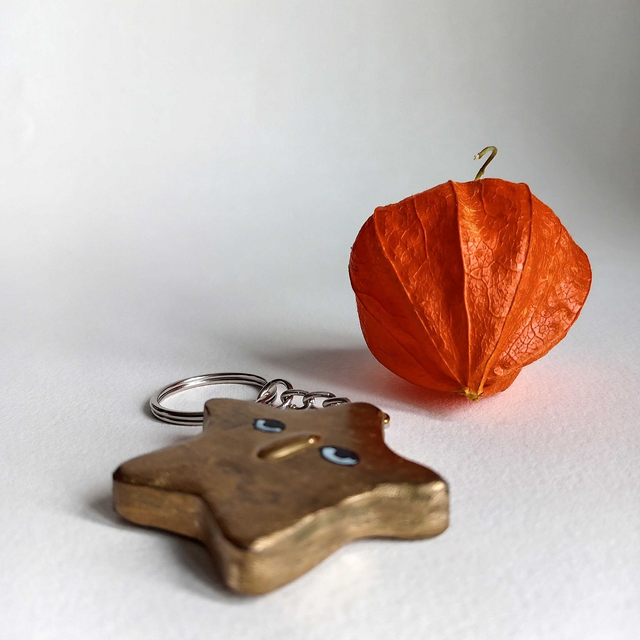 Porte clés étoile dorée