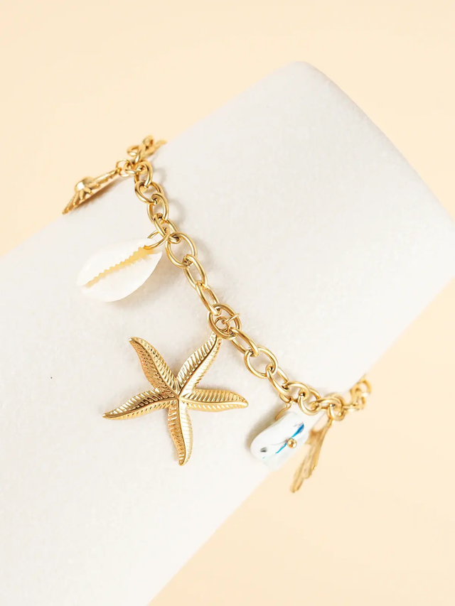 Bracelet chaîne dorée breloques de la mer blanc
