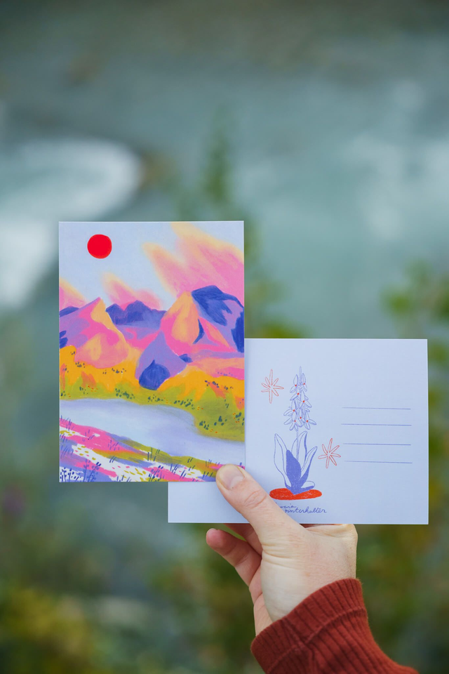 red sun over a lake postcard