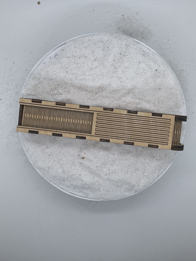 Coffret Stylo avec ouverture coulissante style boîte à pain.