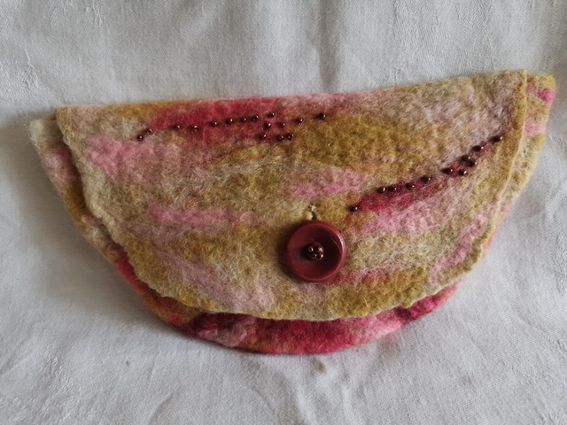 Pink and gold felted clutch bag