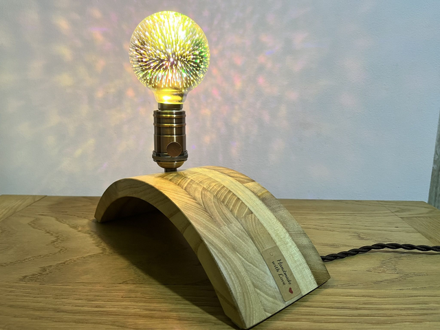 Decorative lamp made of Paulownia wood with a 3D light bulb.