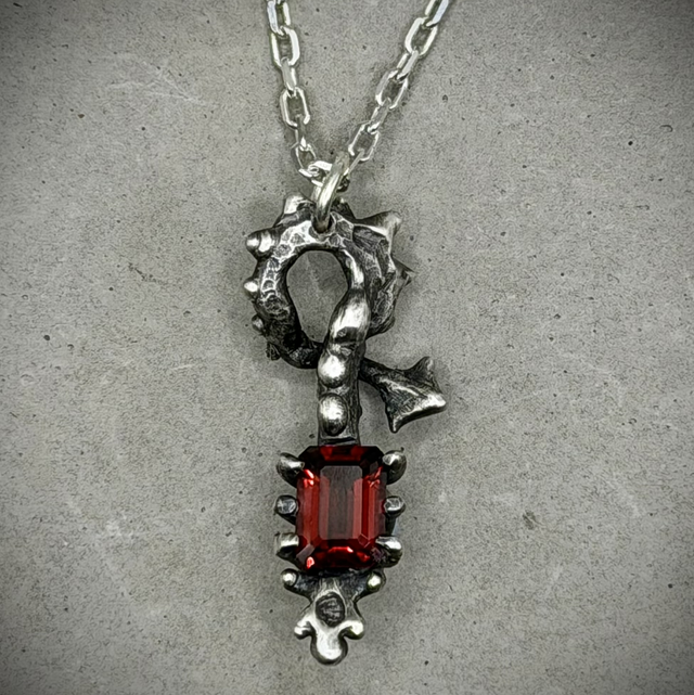 Garnet Skeletal Form pendant necklace