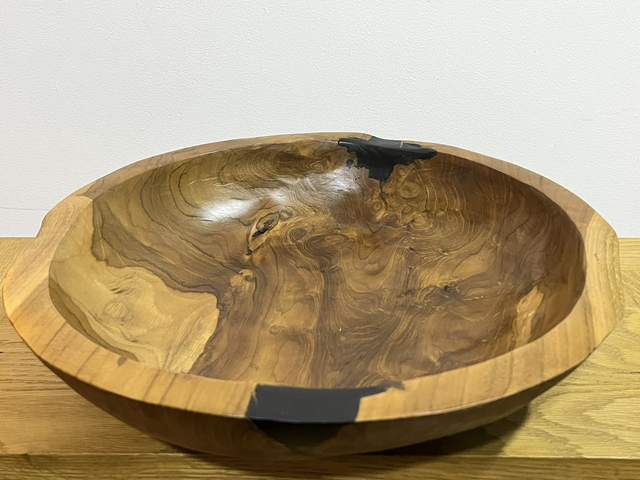 Fruit bowl made from teak tree root.