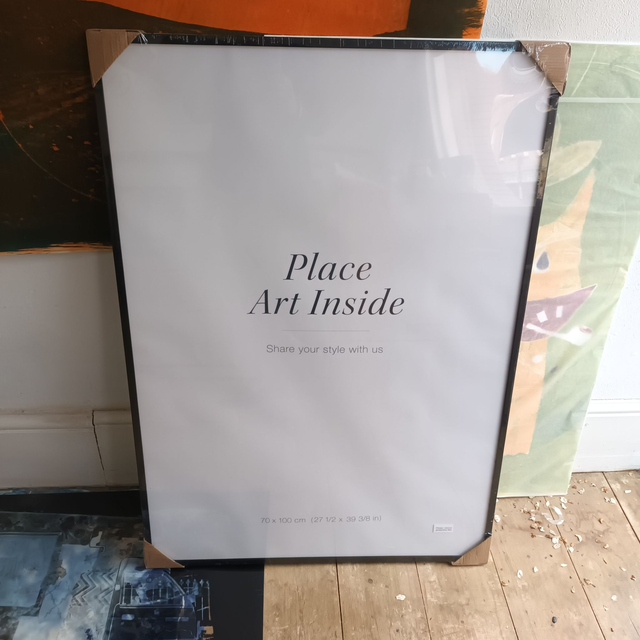 Wooden black painted frame with quality acrylic glass 70cmx100cm incl mount board.