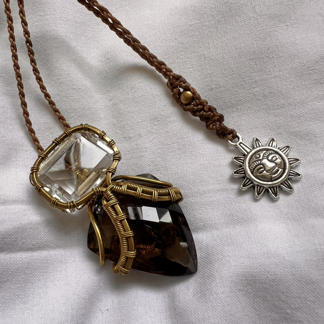 🜂 “Alchemic Balance” – Smoky Quartz & Clear Quartz Pendant with Brass & Sun Talisman