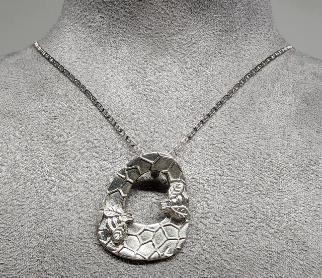 Two bee ring fine silver pendant