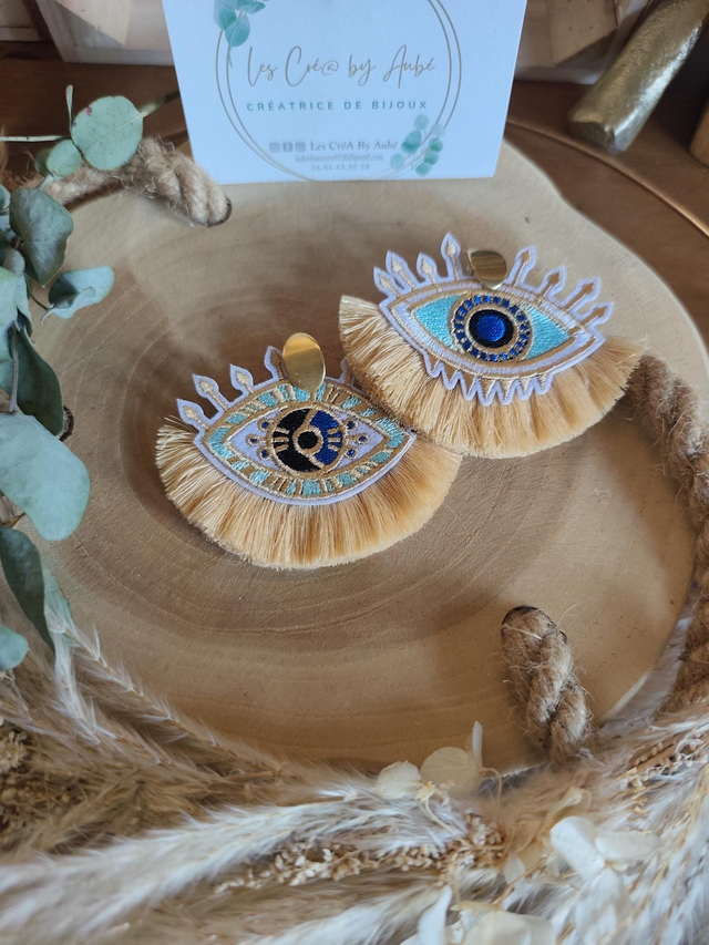 BO BOHEME OEIL ASYMETRIQUE / POMPONS BEIGE 0000755