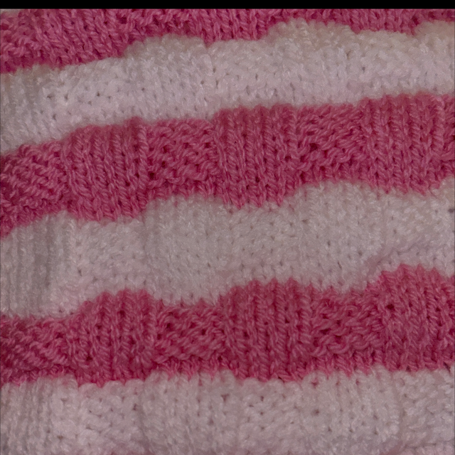 Pink and white striped blanket 