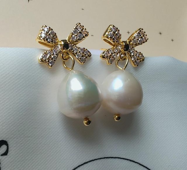 Gold pearl bow earrings