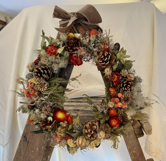 bright autumn wreath with velvet ribbon