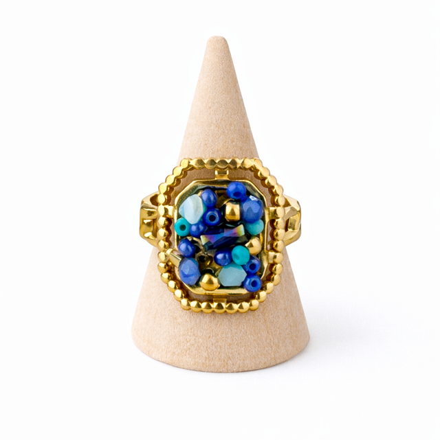 Anillo acero dorado piedras azules 