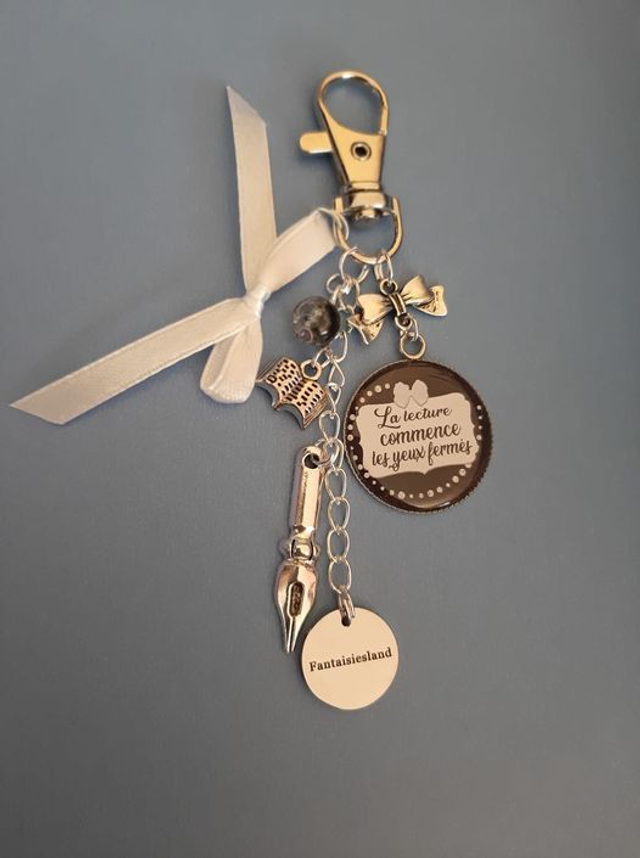 Bijou de sac argenté - La lecture commence les yeux fermés