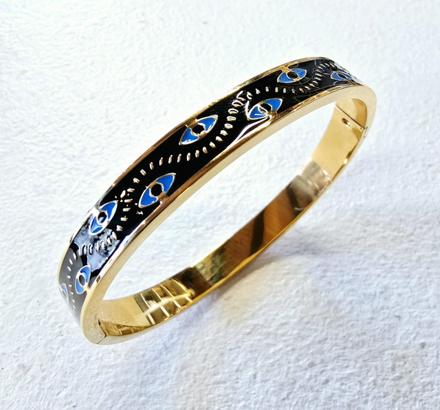 Bracelet jonc en acier inoxydable doré avec email noir et yeux bleus