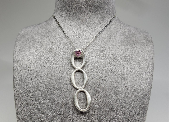 Three ring drop pendant with pink heart cubic zirconia on silver necklace
