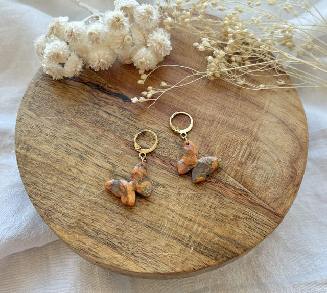 Papillon orange irisé/vert