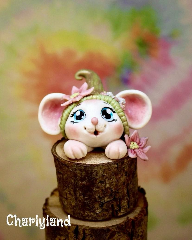 Souris sur socle haut