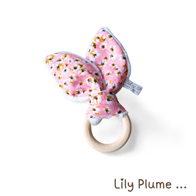 Hochet de dentition rose à fleurs jaune