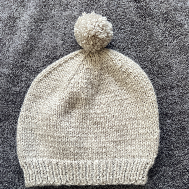 Grey hat with pompom