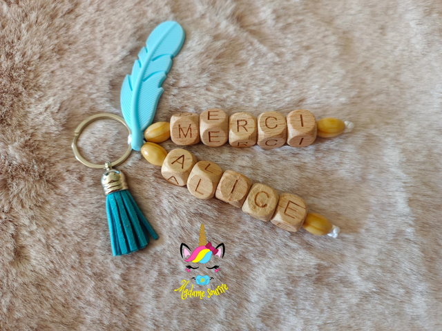 Porte clés 2 branches liées Plume 